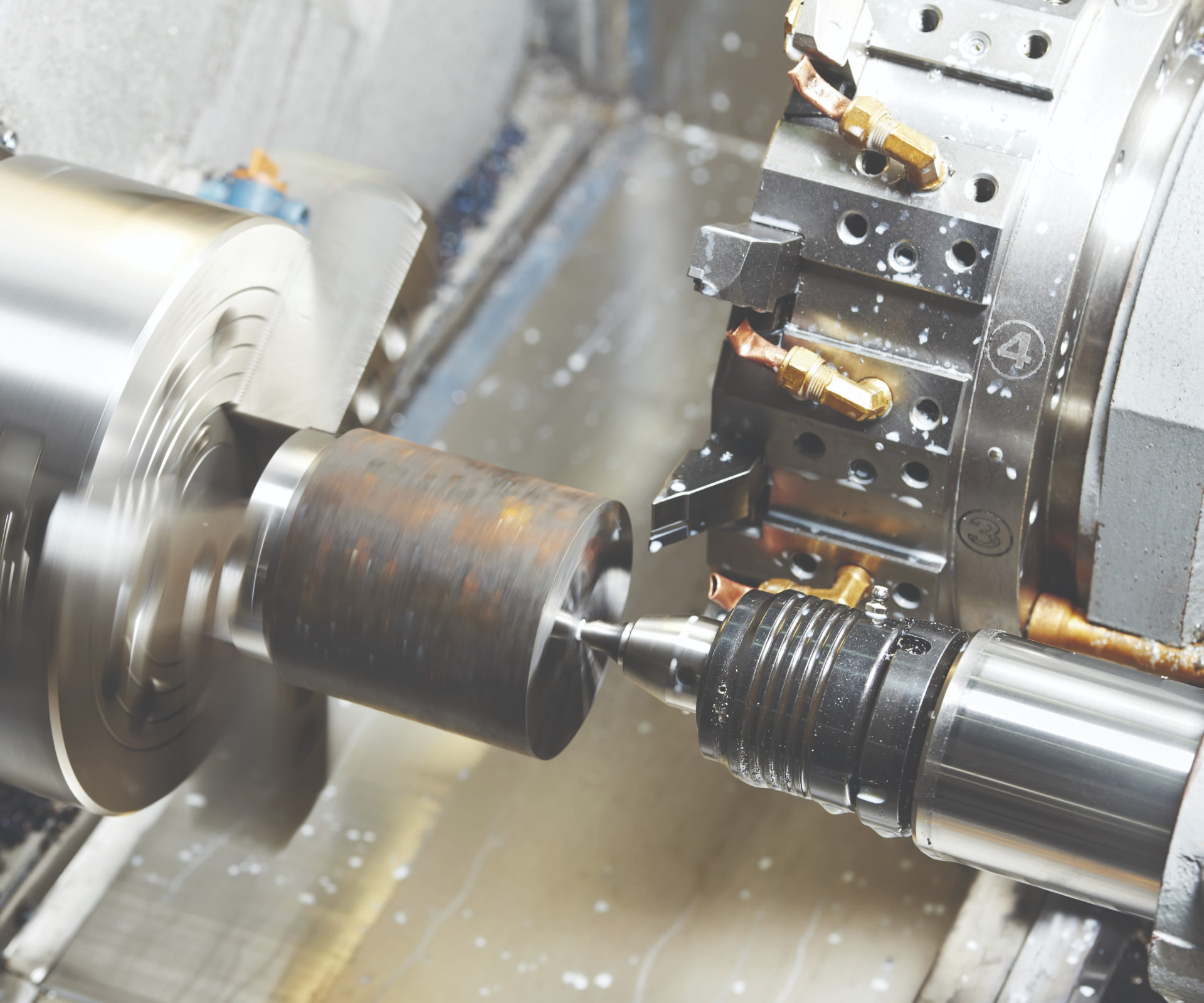 CNC lathe machining a steel component